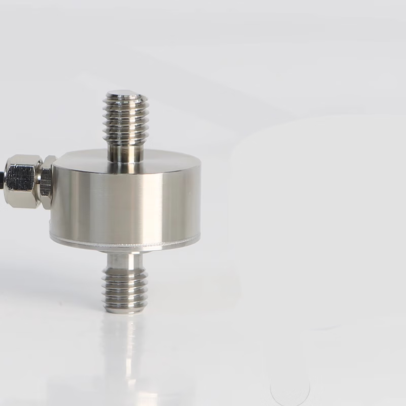 USAMR miniature diaphragm tension/compression sensor weighing module for automated force measurement of pull rods with high precision.